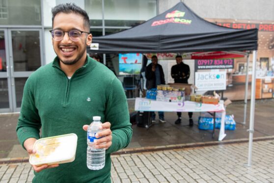 Sufian Ali and Aberdeen Muslims' Foodbox team on St Nicholas Street, handing out hot meals. Picture by Kami Thomson/DC Thomson