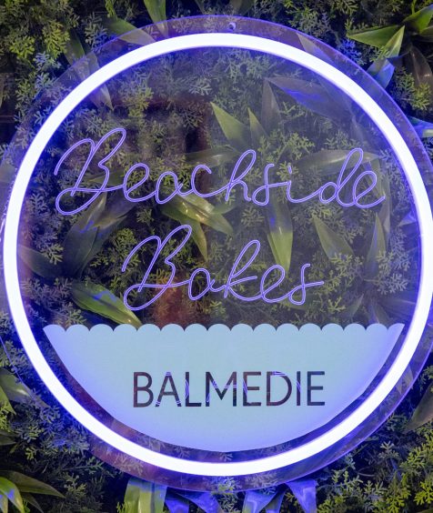 Neon sign reads: "Beachside Bakes, Balmedie"