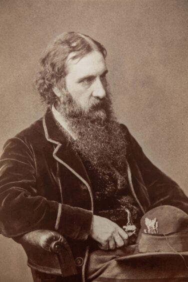 A photo of Huntly author George MacDonald, with a long beard.