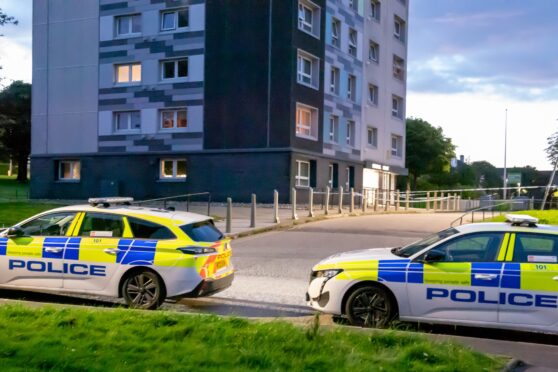 Police stationed at Rosehill Court. Image: Kami Thomson/DC Thomson