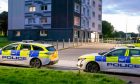 Police stationed at Rosehill Court. Image: Kami Thomson/DC Thomson