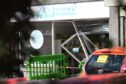 A car has crashed into a pet shop in Cults. Image: Kami Thomson/DC Thomson.