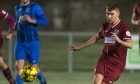 Jordan Cooper in action for Keith, who face Clachnacuddin. Picture by Jasperimage.