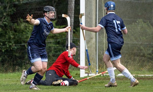 Dan MacDonald (left) in action for Skye. Image: Neil G Paterson.