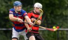 Kingussie's Robert Mabon with Ross MacMillan (Oban) in the 2024 Artemis MacAulay Cup final.