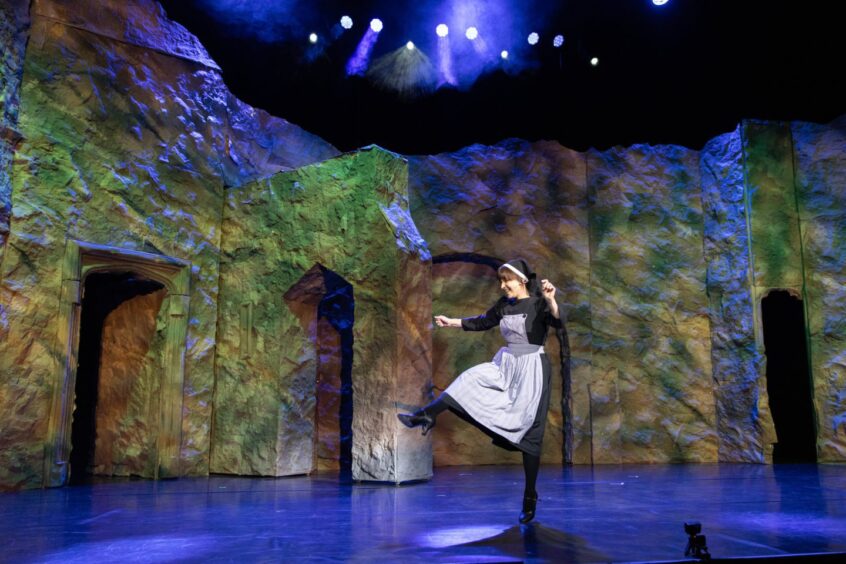 Alison Ozog as Maria dancing in her postulant's costume.