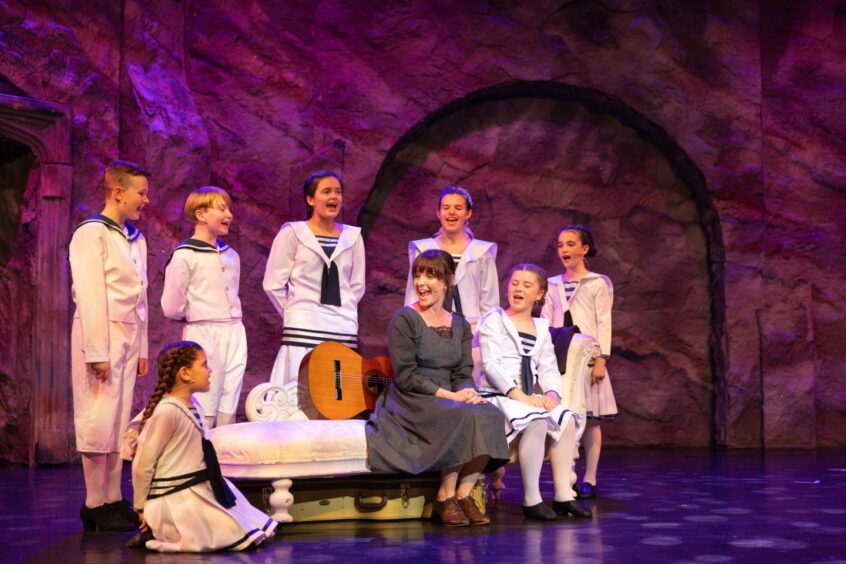 Maria (Alison Ozog) sings with the seven Von Trapp children during the The Sound of Music show at Eden Court, Inverness.