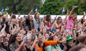 Fans cheering in MacMoray crowd.