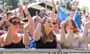 MacMoray fans clap to music.