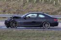 The black BMW, which was allegedly driven by Gavin Coull, sits at the side of the A90. Image: Newsline Media