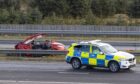 Police at the scene of the horrific crash on the A90 near Ellon. Image: Newsline Media