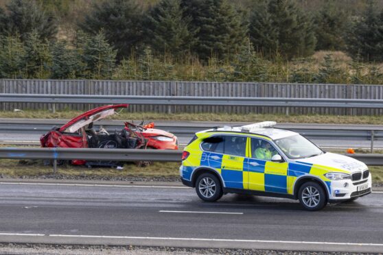 Police at the scene of the horrific crash on the A90 near Ellon. Image: Newsline Media