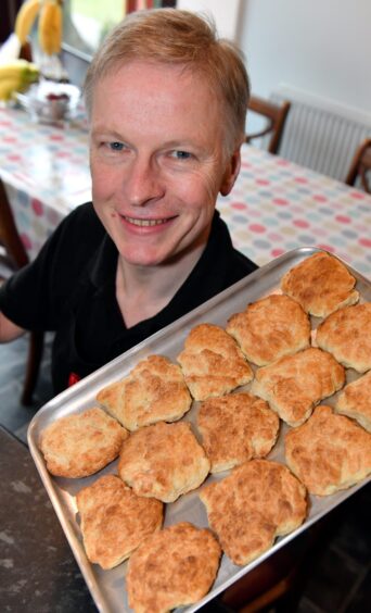 Martin Gillespie and a tray of butteries