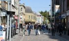 A general view of Inverness High Street with shoppers exploring whats on offer.