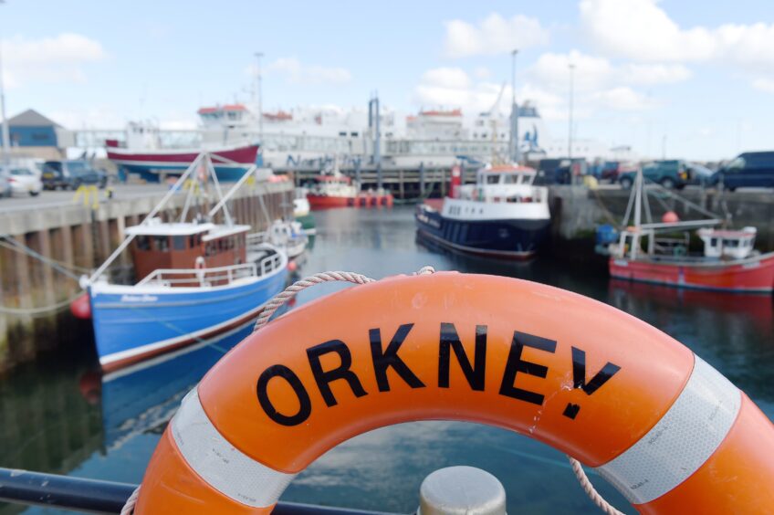 Stromness harbour, Orkney with the ferry, 'Hamnavoe' at her berth.