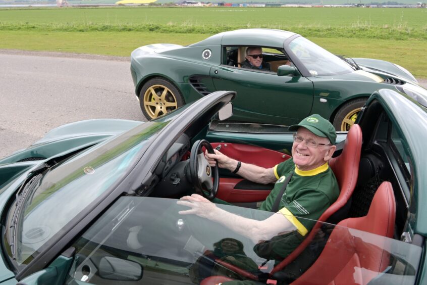 James at the wheel of his open top Lotus Elan. 