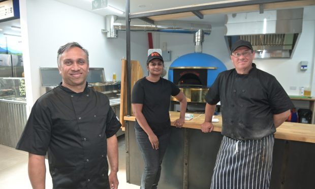 Karthikappallil George, Saritha Nadikuda and chef Giuseppe Dimola at the new market premises. Image 
Sandy McCook/DC Thomson