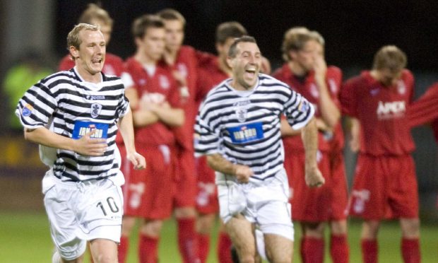 The Queen's Park players run off to celebrate following a penalty shoot-out win over Aberdeen in 2006. Image: SNS.