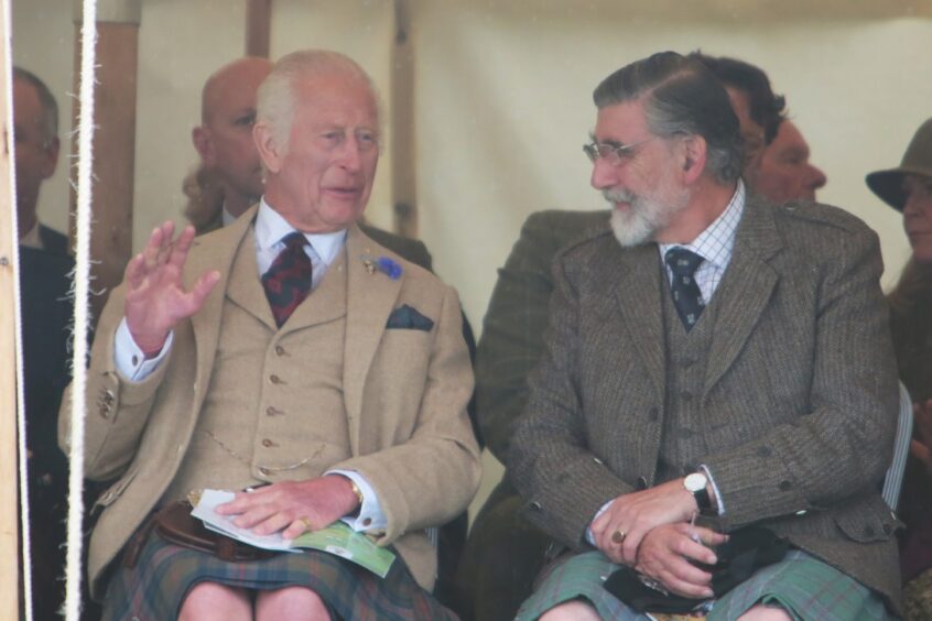 King Charles speaking to a fellow attendee at the Caithness games.