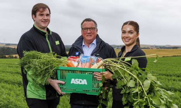 Philip Benzies, owner of Benzies Produce, with Asda Huntly produce colleague Rhys McWilliam and section leader Rebecca MacDougall.