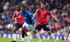 Ross County defender Will Nightingale in action against Rangers.