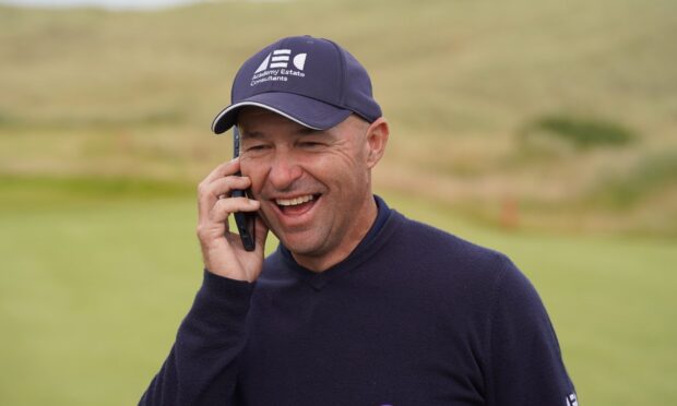 Robert Coles on the phone to US president Donald Trump after winning the PGA Seniors Championship at Trump International Links. Image: Legends Tour.
