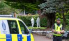 Officials in white forensic suits were on scene. Image: Jasperimage.