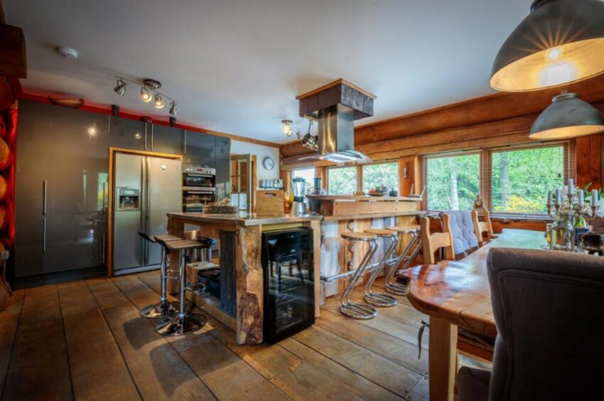 Large kitchen/diner with wooden accents.