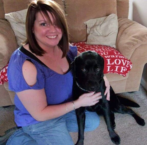 Karen with Sadie the black lab. 