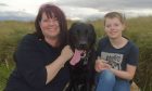 Karen Sabiston with Sadie the black lab and her son Sweyn.