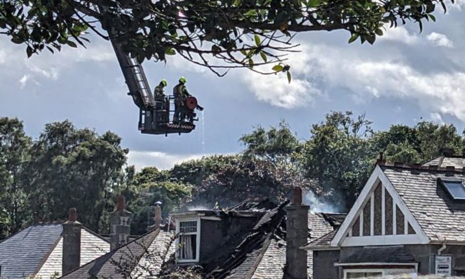 The fire service 'dampening down' at Westburn Drive in Aberdeen.