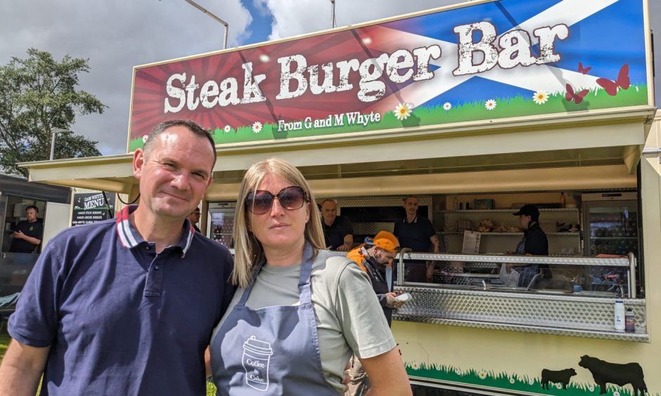 Graham and Claire Whyte outside burger van. 