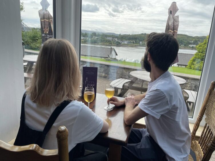 Guests at the Lochnell Arms Hotel can enjoy a drink with a view of the Falls of Lora rapids on Loch Etive. 