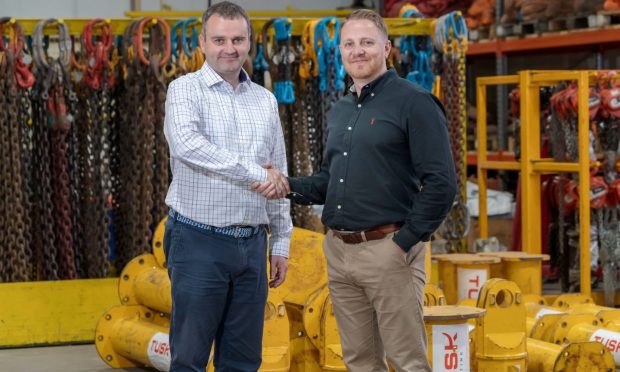 Martin Suttie, managing director of First Integrated Solutions (left) and Kevin Chalmers, managing director of Tusk Lifting (right). Image: True North