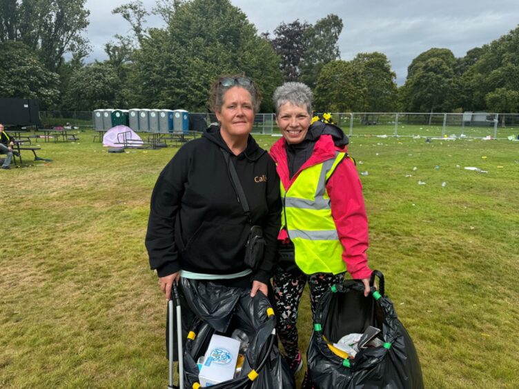 Volunteers Cally Day and Doreen Mitchell during the litter-pick after MacMoray festival.