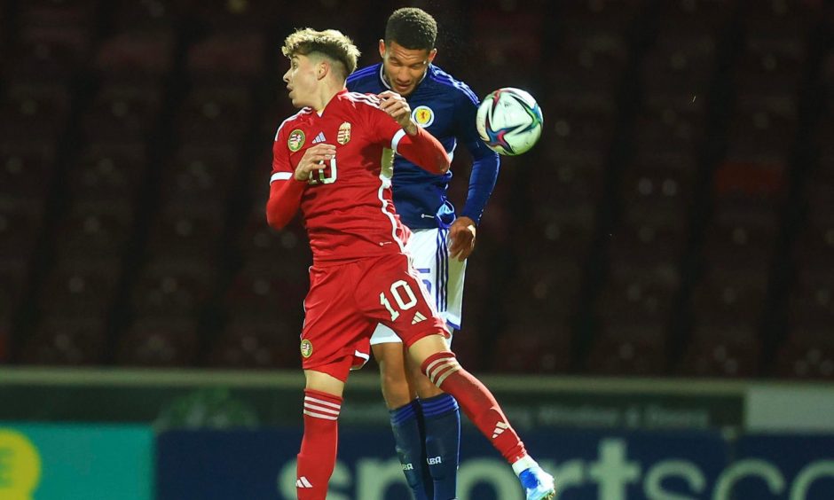 Mandatory Credit: Photo by David Young/Action Plus/Shutterstock (14146753al) Ibane Bowat of Scotland heads clear from Dominik Kocsis of Hungary; Fir Park, Motherwell, Scotland; UEFA Under-21 Euro 2025 Qualifier Football, Scotland U21s versus Hungary U21s. Scotland U21's v Hungary U21's, UEFA Euro Qualifiers, Football, Fir Park, Motherwell, Scotland, UK - 13 Oct 2023