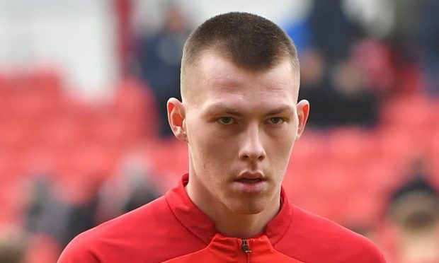 Dundee United manager Tam Courts held up a 'show racism the red card' T-shirt at full-time.