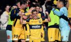 Josh Nisbet celebrates following Central Coast Mariners' A-League Grand Final victory. Image: Shutterstock.