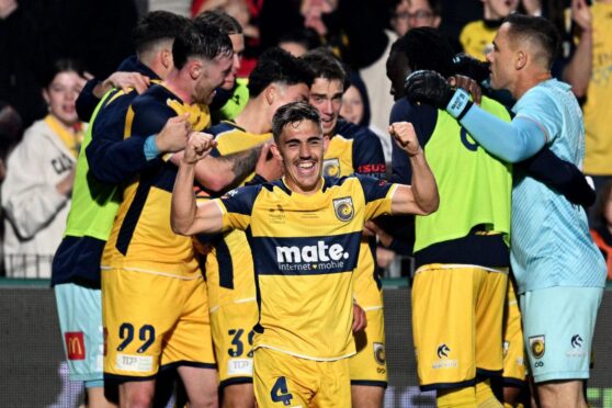 Josh Nisbet celebrates following Central Coast Mariners' A-League Grand Final victory. Image: Shutterstock.