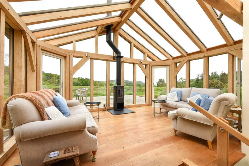 A glass sun room at Raera Farmhouse. 