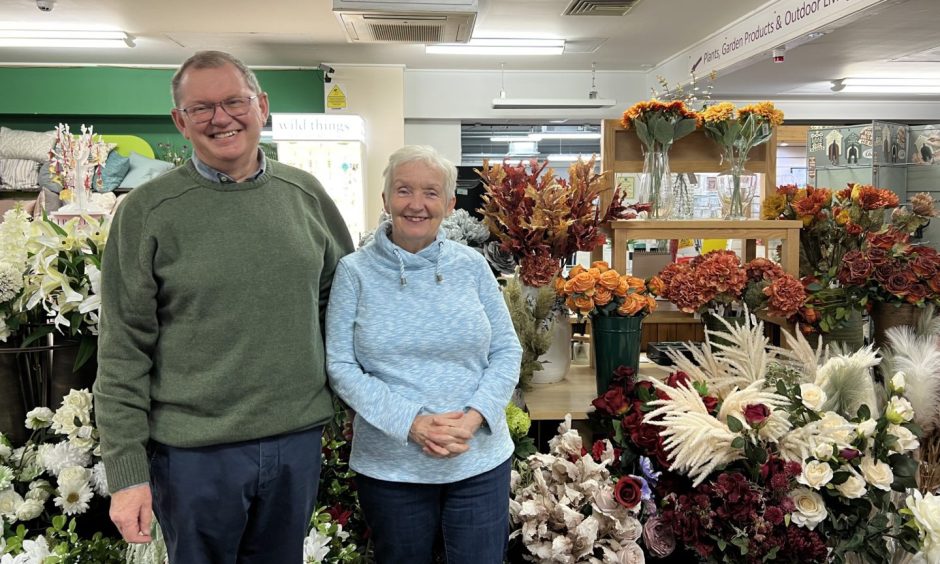 Peter Wilson with wife Heather inside garden centre. 