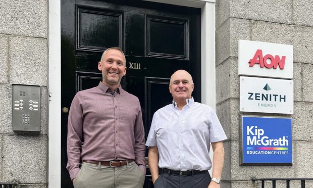 Chris Collie, operations director, and Martin Booth, managing director of Zenith Energy outside new headquarters in Aberdeen's Bon Accord Square. Image: Mearns & Gill