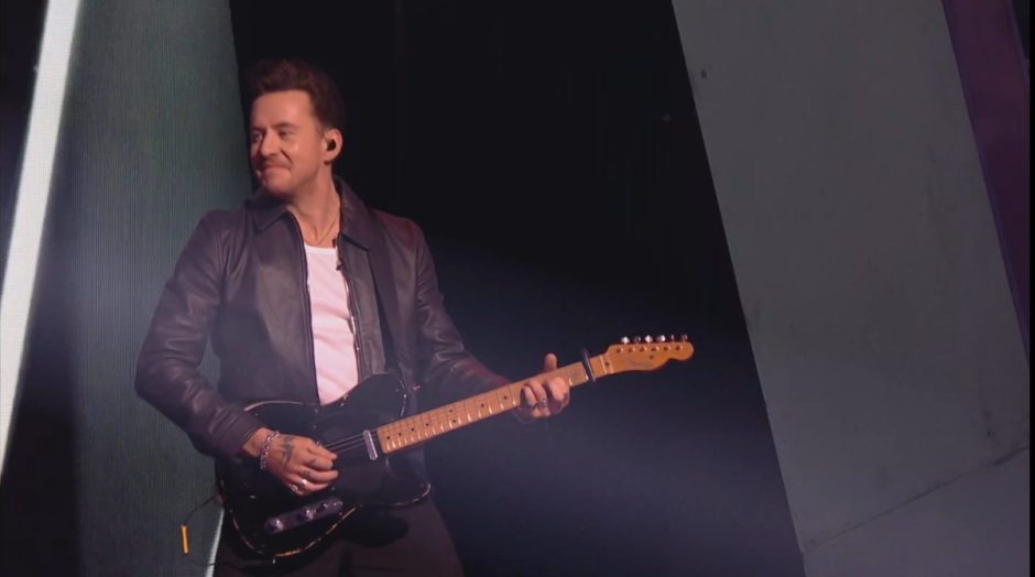 Danny Jones from McFly playing guitar.