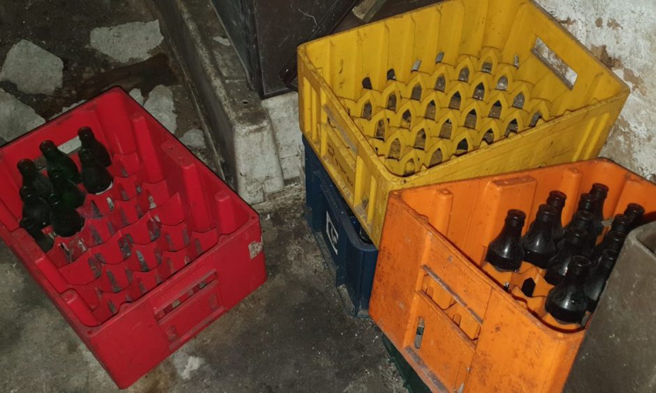 Empty bottles in plastic crates. 