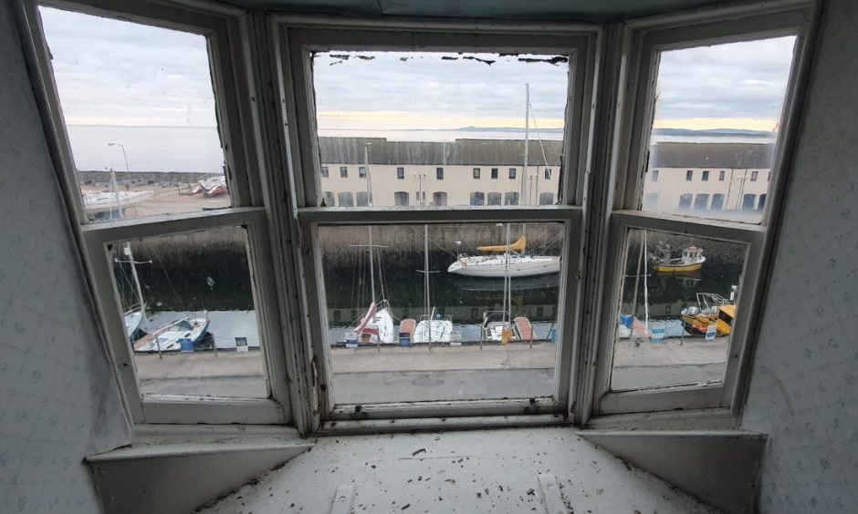 Looking through window at Lossiemouth marina. 