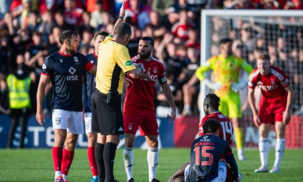 Aberdeen's Graeme Shinnie complains to referee Euan Anderson during the match against Ross County. Image: SNS.