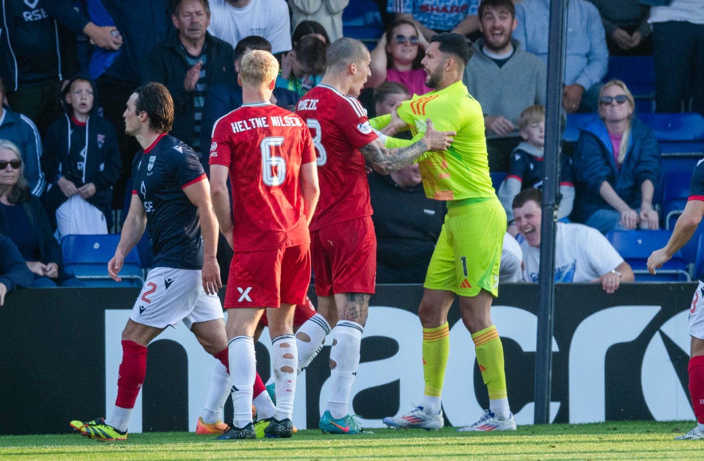 Aberdeen's Dimitar Mitov celebrates with Slobodan Rubezic after saving a penalty from Ross County's Ronan Hale. Image: SNS