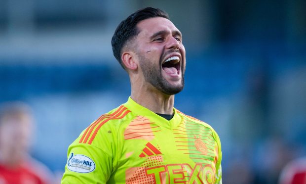 Aberdeen's Dimitar Mitov celebrates saving a penalty in the 1-0 win against Ross County. Image: SNS