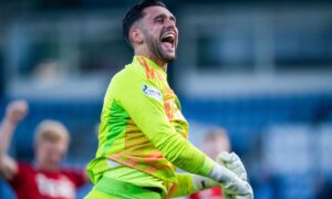 Aberdeen keeper Dimitar Mitov celebrates at full time after the 1-0 win against Ross County. Image: SNE