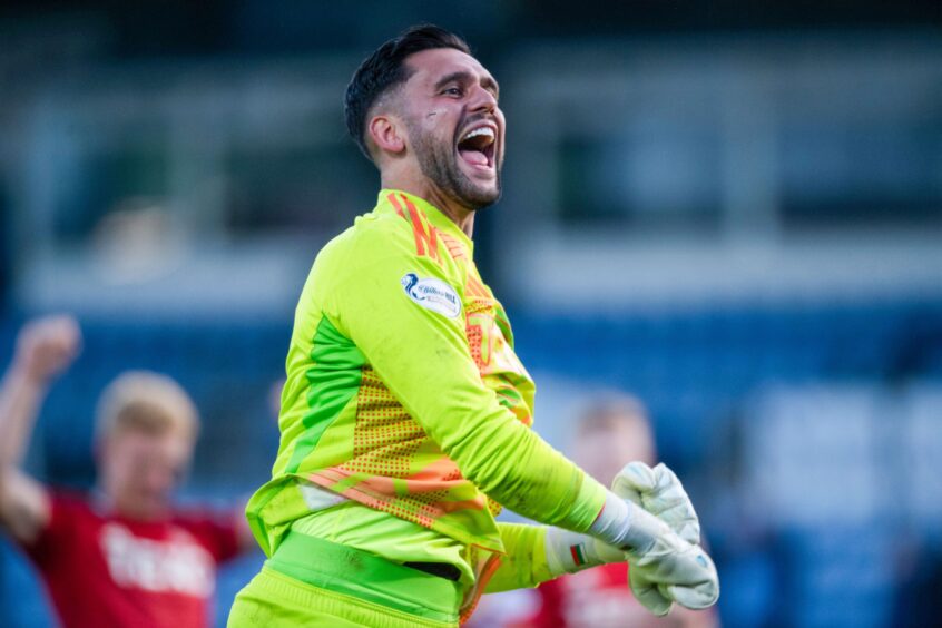 Aberdeen keeper Dimitar Mitov celebrates at full time after the 1-0 win against Ross County. Image: SNE